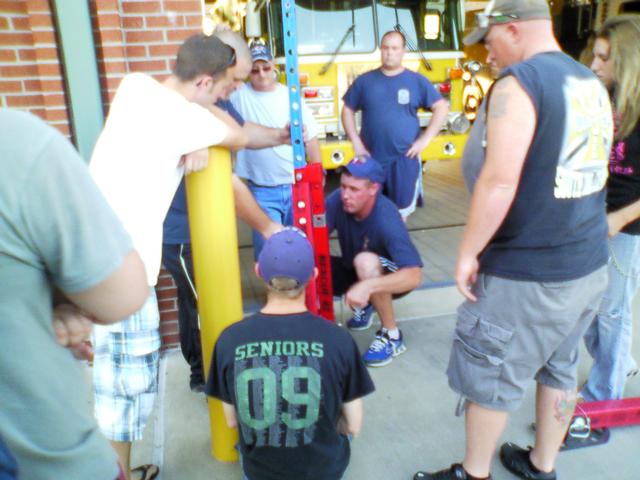 Chief 3B Wharenbrock giving a demo on the 42 Rescue Struts 06/21/10. Firefighters Wade Mahaffey, Richard Roloson II, Tom Eno, Tommy Fairfax, Ken Spaulding, Sabrina Wood, and Brian Yount.